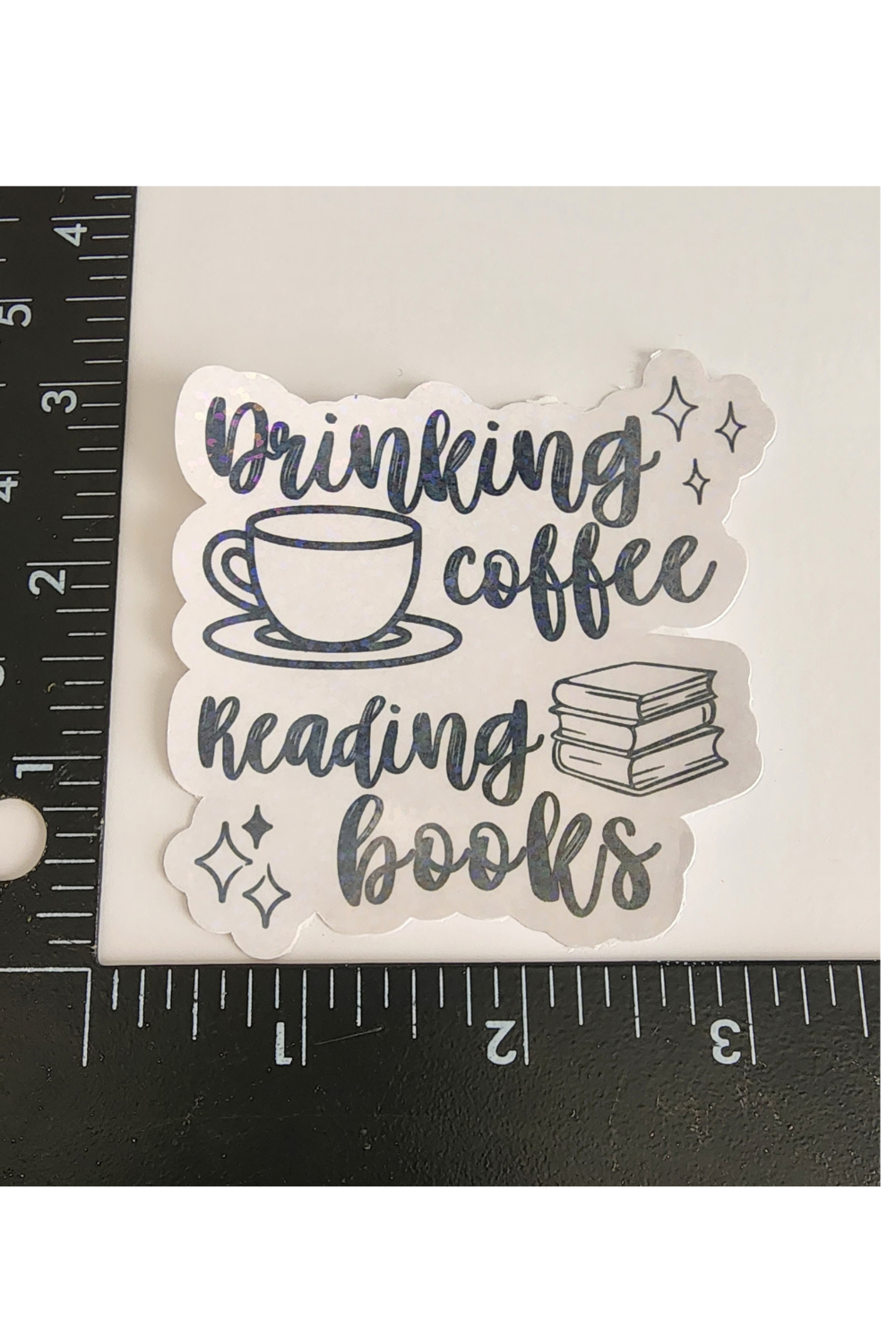 Drinking Coffee Reading Books– 3" Holographic Sticker